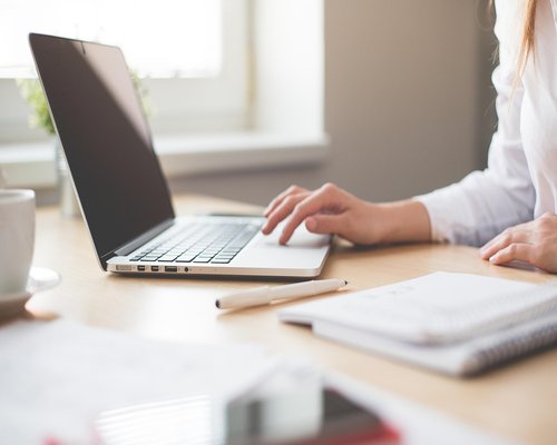 Desk near window with natural light for healthy visual environment